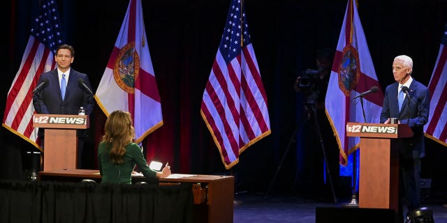 Ron DeSantis, governor of Florida, and Charlie Crist, Democratic gubernatorial candidate for Florida, during the Florida gubernatorial debate in Fort Pierce, Florida, US, on Monday, Oct. 24, 2022.