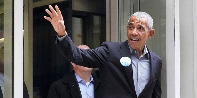 Former President Barack Obama waves to the crowd after casting his ballot at a primary voting location in Chicago on Monday, October 17, 2022.