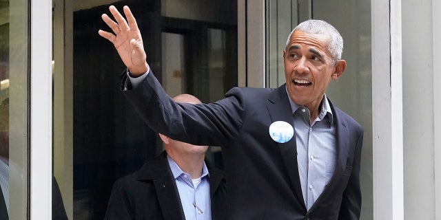 Former President Barack Obama waves to the crowd after casting his ballot at an early voting site Monday, Oct. 17, 2022, in Chicago.