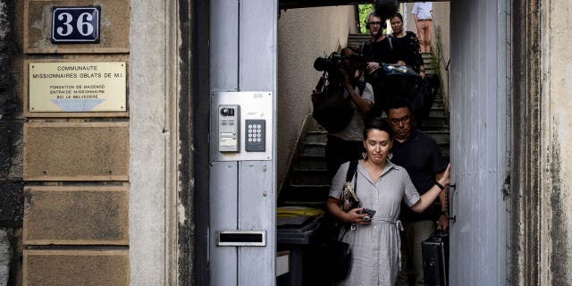 Members of the Inuit delegation exit a religious congregation in Lyon, on Sept. 14, 2022. Members came to France to ask for the extradition of French-Canadian priest Joannes Rivoire, accused of sexual assault against children.