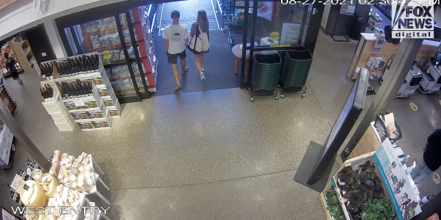 Brian Laundrie and Gabby Petito exit the Jackson, Wyoming, Whole Foods store on Aug. 27. 2021.