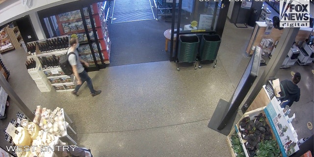 Gabe Pettito can be seen in the lower left of this photo making her selection from a cheese display at Whole Foods in Jackson, Wyoming, on August 27, 2021.
