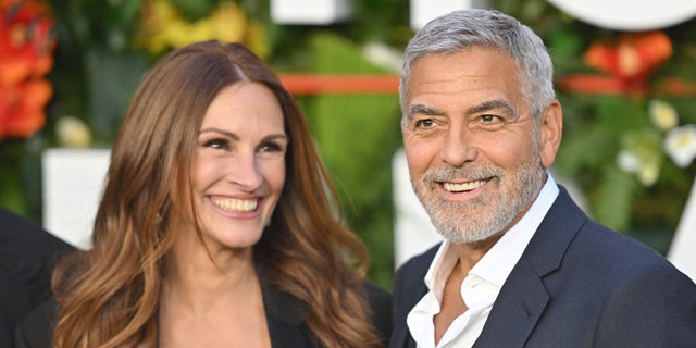 Julia Roberts and George Clooney joked they never even thought about dating each other as they became fast friends. The actors were pictured at the "Ticket To Paradise" premiere in September. 