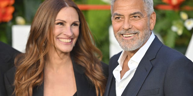 Julia Roberts and George Clooney joked they never even thought about dating each other as they became fast friends. The actors were pictured at the "Ticket To Paradise" premiere in September. 