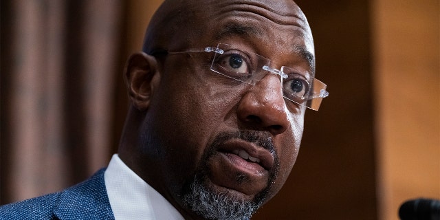 FILE - Sen. Raphael Warnock, D-Ga., questions Treasury Secretary Janet Yellen as she testifies before the Senate Banking, Housing, and Urban Affairs Committee hearing, May 10, 2022, on Capitol Hill in Washington.