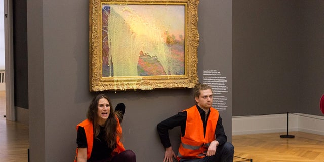 Climate change activists destroy painting to draw attention to climate change. 