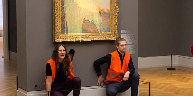 Climate change activists destroy painting to draw attention to climate change. 