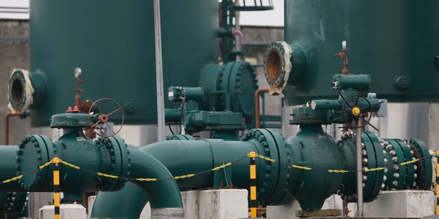 Pipelines and tanks are pictured in a gas terminal Thursday, Oct. 13, 2022 in Obergailbach, eastern France. France has for the first time started conveying natural gas to Germany, French gas network operator GRTgaz said Thursday, as Berlin strives to diversify its energy supply following the interruption of Russian gas deliveries. GRTgaz said in a statement the gas pipeline connecting both countries at the French border village of Obergailbach has began delivering an initial daily capacity of 31 gigawatt-hours.