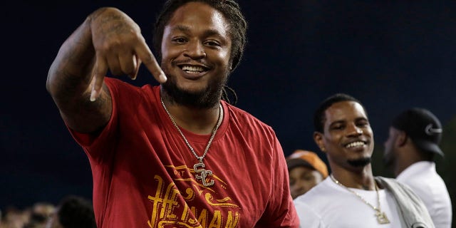 Retired NFL player and USC Trojans running back LenDale White celebrates during the game against the Texas Longhorns at Darrell K Royal-Texas Memorial Stadium on Sept. 15, 2018 in Austin, Texas.