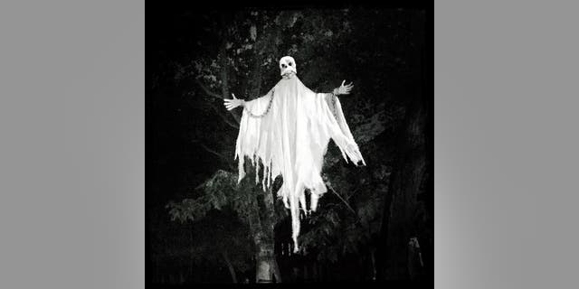 A cloaked and chained skeletal ghost figure hangs in a tree in the Cobble Hill neighborhood of Brooklyn, New York, for Halloween 2022. "I get it. It's fun to trick people and it's fun to get views," said Hannah Lehmann of Washington state. "As long as you aren't hurting others in the process, I don't think we should be ‘mad’ at people for posting these fake videos."