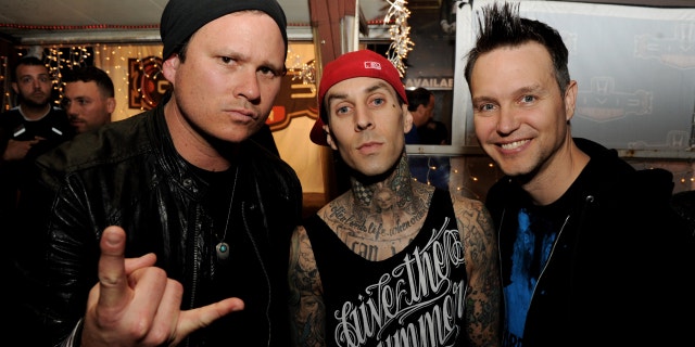 Musicians Tom DeLonge, Travis Barker and Mark Hoppus of blink-182 pose at a press party of announce the 2011 Honda Civic Tour featuring blink-182 and My Chemical Romance at the Rainbow Bar and Grill on May 23, 2011 in West Hollywood, California.