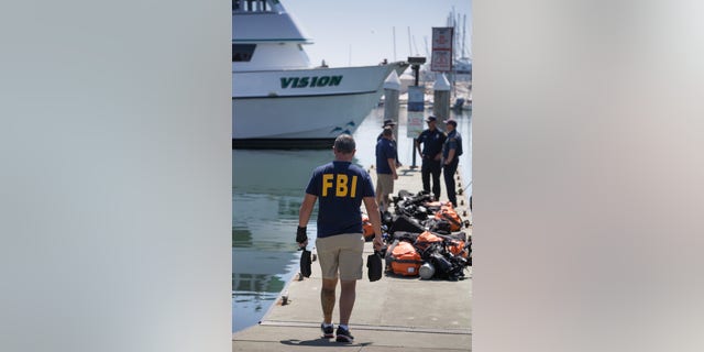 Members of the FBI's Underwater Search and Evidence Response Team prepare to retrieve the final body from the Conception dive boat on September 5, 2019, in Santa Barbara, California.