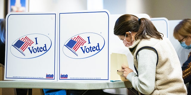 Voters are shown casting ballots at a U.S. polling location on Nov. 2, 2021.