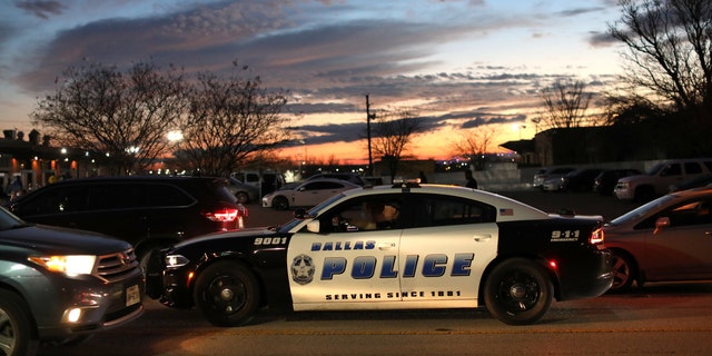 FILE PHOTO: A Dallas Police Department vehicle patrols an area in Dallas, Texas.