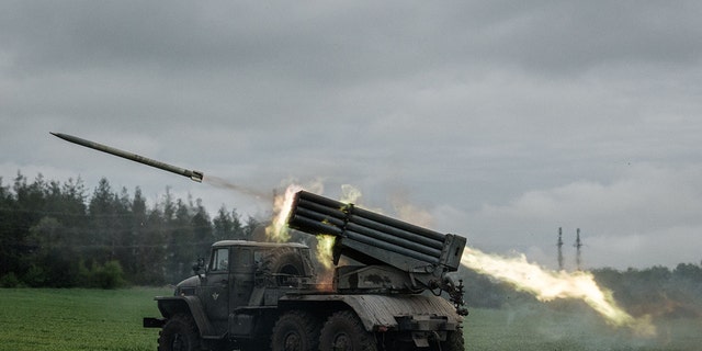 A rocket is launched from a truck-mounted multiple rocket launcher near Svyatohirsk, eastern Ukraine, on May 14, 2022, amid the Russian invasion of Ukraine. 