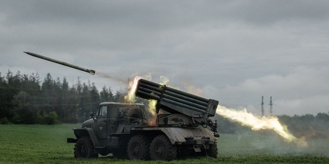 A rocket is launched from a truck-mounted multiple rocket launcher near Svyatohirsk, eastern Ukraine, on May 14, 2022, amid the Russian invasion of Ukraine. 