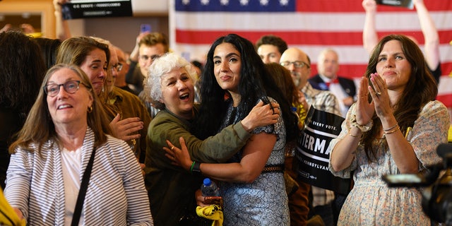 Gisele Fetterman is hugged by her mother, Ester Resende, during a primary election night event in Pittsburgh, Pennsylvania, on May 17, 2022.