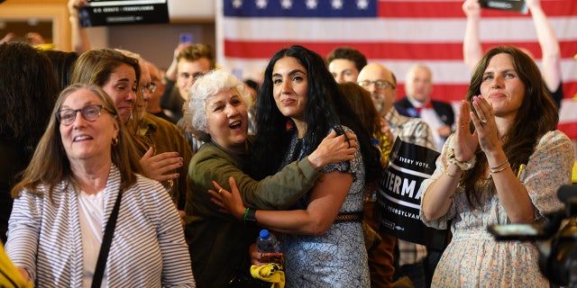 Gisele Fetterman is hugged by her mother, Ester Resende, during a primary election night event in Pittsburgh, Pennsylvania, on May 17, 2022.