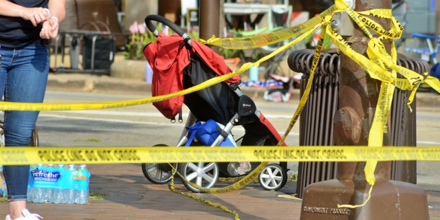 A stroller and other items remain near the scene of the shooting in Highland Park, Illinois, on July 5, 2022. (Jacek Boczarski/Anadolu Agency via Getty Images)