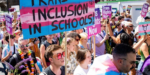 A protester voices support for the promotion of transgender ideology in schools during a pro-transgender march in London, UK on July 9, 2022. 