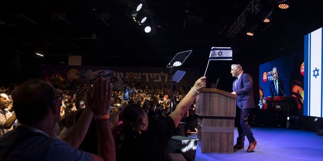 Israeli Prime Minister Yair Lapid speaks to supporters during the party's opening election campaign rally on Aug. 3, 2022, in Tel Aviv. (Amir Levy/Getty Images)