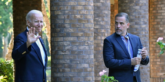 President Biden waves alongside his son Hunter Biden after attending mass at Holy Spirit Catholic Church in Johns Island, South Carolina, on Aug. 13, 2022.