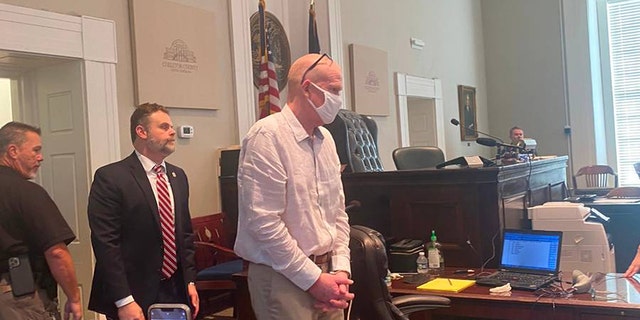 Once-prominent South Carolina attorney Alex Murdaugh, right, enters Colleton County court in South Carolina on July 20, 2022, for a bond hearing on murder charges. 