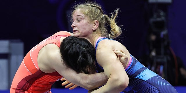 Masako Furuichi (RED) of Japan in action against Amit Elor (BLUE) of USA during the Womens Free Style World Wrestling Championship Semi finals match at Stark Arena on September 14, 2022, in Belgrade, Serbia. 