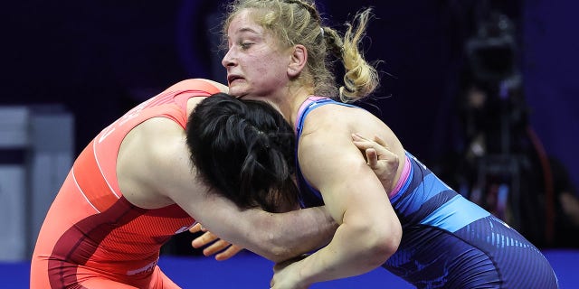 Masako Furuichi (RED) of Japan in action against Amit Elor (BLUE) of USA during the Womens Free Style World Wrestling Championship Semi finals match at Stark Arena on September 14, 2022, in Belgrade, Serbia.