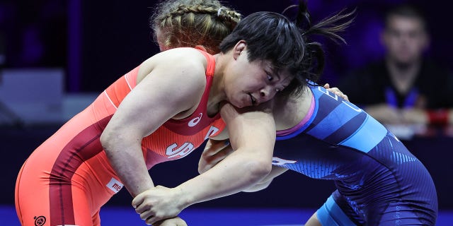 Masako Furuichi (RED) of Japan in action against Amit Elor (BLUE) of USA during the Womens Free Style World Wrestling Championship Semi finals match at Stark Arena on September 14, 2022, in Belgrade, Serbia.