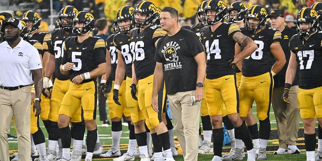 Iowa offensive coordinator Brian Ferencz watches the team warm up before a college football game between the Nevada Wolfpack and the Iowa Hawkeyes at Kinnick Stadium in Iowa City, Iowa on September 17, 2022 . 