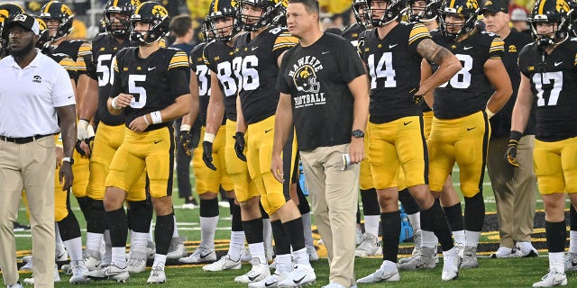 Iowa offensive coordinator Brian Ferentz watches his team warm up before a college football game between the Nevada Wolfpack and the Iowa Hawkeyes, Sept. 17, 2022, at Kinnick Stadium, Iowa City, Iowa.