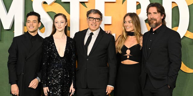 (From L) U.S. actor Rami Malek, British actress Andrea Riseborough, U.S. filmmaker David O Russell, Australian actress Margot Robbie and British actor Christian Bale pose upon arrival to attend the European premiere of the film "Amsterdam" in Leicester Square, central London, on September 21, 2022. (Photo by SEBASTIEN BOZON / AFP) (Photo by SEBASTIEN BOZON/AFP via Getty Images)