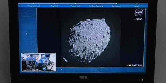 A television at NASA's Kennedy Space Center in Cape Canaveral, Florida, captures the final images from the Double Asteroid Redirection Test (DART) just before it smashes into the asteroid Dimorphos on September 26, 2022.