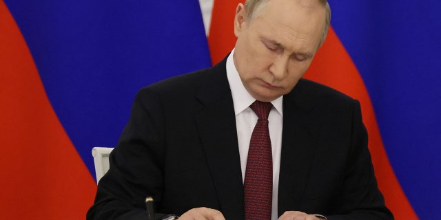 Russian President Vladimir Putin attends a ceremony to sign treaties formally annexing four regions of Ukraine Russian troops occupy - Lugansk, Donetsk, Kherson and Zaporizhzhia, at the Kremlin in Moscow on September 30, 2022. 