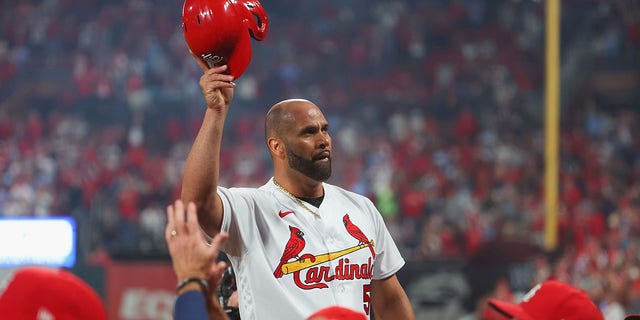 Albert Pujols #5 of the St. Louis Cardinals takes a curtain call after hitting his 701st career home run while playing against the Pittsburgh Pirates in the fourth inning at Busch Stadium on September 30, 2022, in St Louis, Missouri. 