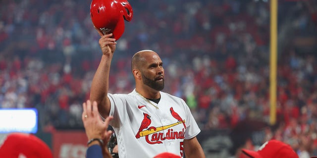 Albert Pujols #5 of the St. Louis Cardinals takes a curtain call after hitting his 701st career home run while playing against the Pittsburgh Pirates in the fourth inning at Busch Stadium on September 30, 2022, in St Louis, Missouri. 