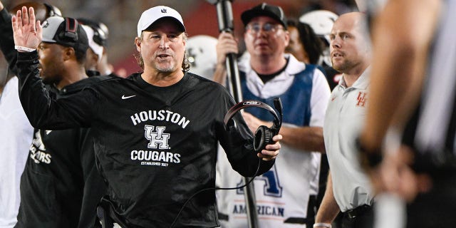 Houston Cougars head coach Dana Holgorsen pleads his case with the official after the Cougars were called for pass interference during the overtime period during the football game between the Tulane Green Wave and Houston Cougars at TDECU Stadium on September 30, 2022, in Houston, TX. 