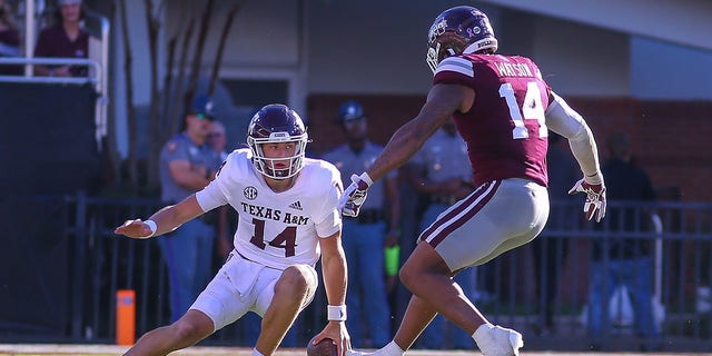 Texas A and M Aggies quarterback Max Johnson (14) cuts back during a game against the Mississippi State Bulldogs Oct. 1, 2022, at Davis Wade Stadium in Starkville, Miss. 
