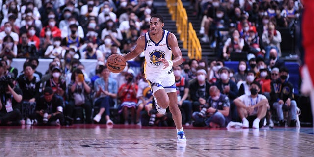 Jordan Poole, of the Golden State Warriors, drives against the Washington Wizards addresses the crowd during the NBA Japan Games 2022 at Saitama Super Arena on Oct. 2, 2022 in Saitama, Japan. 
