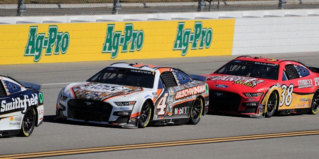 Todd Gilliland (#38 Front Row Motorsports Georgia Peanuts Ford) pressures Kevin Harvick (#4 Stewart Haas Racing Busch Light Ford Mustang) during the running of the Yellawood 500 NASCAR Cup Series Playoff race on Oct. 2, 2022 at the Talladega Superspeedway in Lincoln, Alabama.