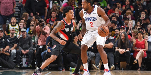 Anfernee Simons #1 of the Portland Trail Blazers plays defense on Kawhi Leonard #2 of the LA Clippers during a preseason game on October 3, 2022 at the Climate Pledge Arena in Seattle, Washington. 