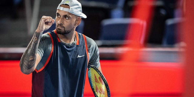 Nick Kyrgios of Australia reacts after a point against Tseng Chun-hsin of Taiwan during their men's singles match at the Japan Open tennis tournament in Tokyo on October 4, 2022. 