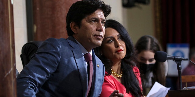 Los Angeles City Council member Kevin de León, left, and City Council President Nury Martinez confer during a meeting on Oct. 4, 2022.
