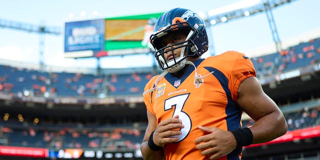 Russell Wilson, #3 of the Denver Broncos, warms up before kickoff against the Indianapolis Colts at Empower Field at Mile High on Oct. 6, 2022 in Denver.