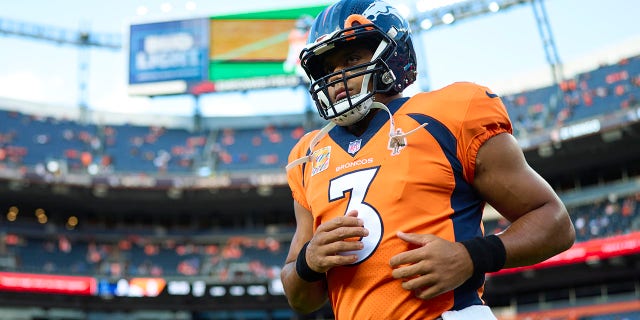 Denver Broncos #3 Russell Wilson warms up before kickoff against the Indianapolis Colts at Empower Field at Denver's Mile High on Oct. 6, 2022.