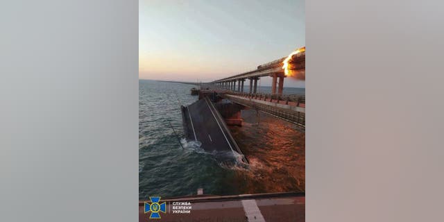 Explosion causes fire at the Kerch bridge (aka the Crimean Bridge) in the Kerch Strait, Crimea, October 8, 2022. 