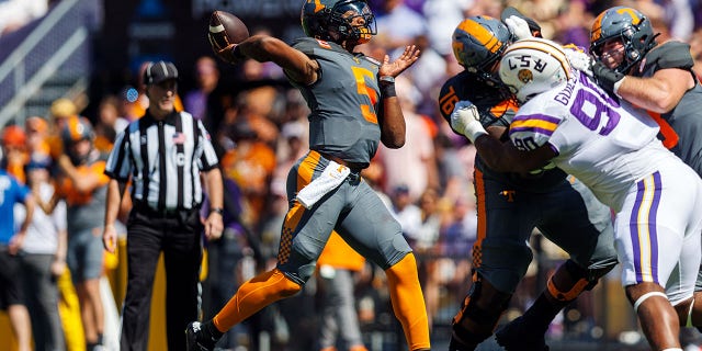 Tennessee Volunteers quarterback Hendon Hooker, #5, throws a touchdown pass during a game between the LSU Tigers and the Tennessee Volunteers on Oct. 8, 2022, at Tiger Stadium in Baton Rouge, Louisiana.