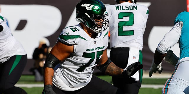 New York Jets guard Arijah Vera Tucker, 75, during the National Football League game between the New York Jets and the Miami Dolphins at MetLife Stadium in East Rutherford, New Jersey on October 9, 2022.