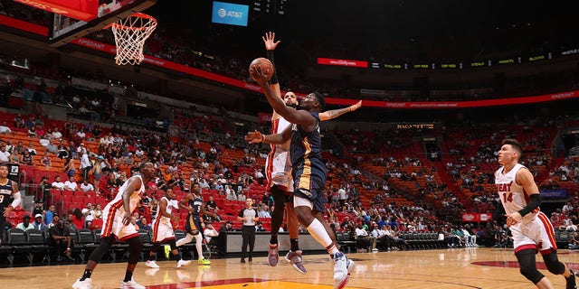 Zion Williamson, #1 of the New Orleans Pelicans, drives to the basket during a preseason game against the Miami Heat on Oct. 12, 2022 at FTX Arena in Miami.